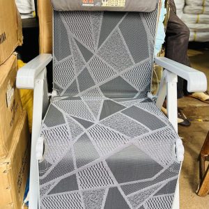 The grey foldable zero gravity reclining lounge chair with easy push back feature to relax  pool lounge Garden Balcony camping trekking outing chair.